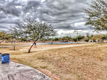 View of empty road against cloudy sky