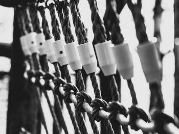 Close-up of chain hanging on fence