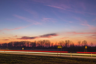 Road against sky at night