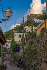 Street amidst buildings against sky