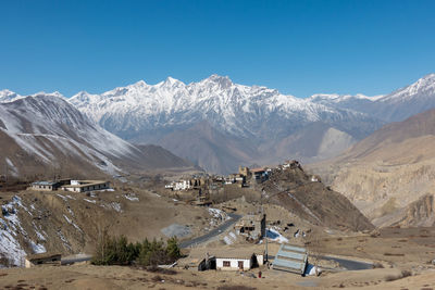 Scenic view of mountains against blue sky