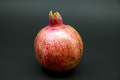 Close-up of apple against black background