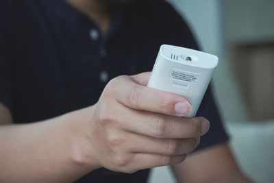 Close-up of man using mobile phone