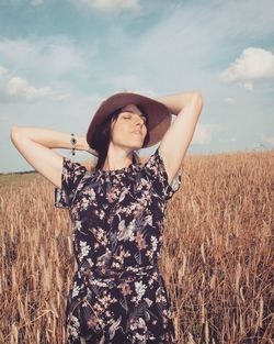 Woman standing at farm