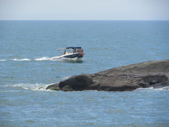 Boat in sea against clear sky