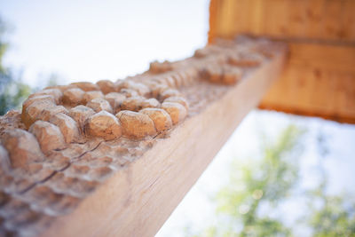 Low angle view of bread on table against sky