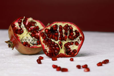 Close-up of pomegranate on snow