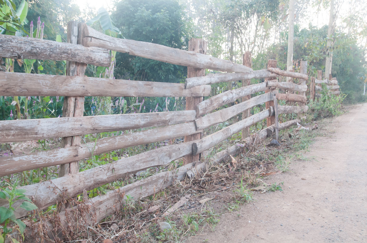 VIEW OF WOODEN FENCE ON LANDSCAPE