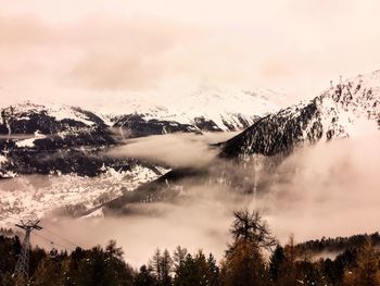 Scenic view of mountains against sky during winter