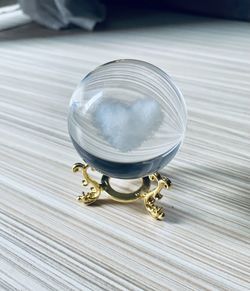 Close-up of crystal ball on table