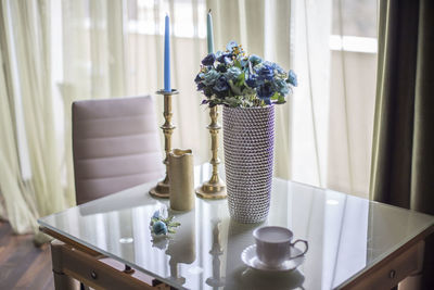 Potted plants on table at home