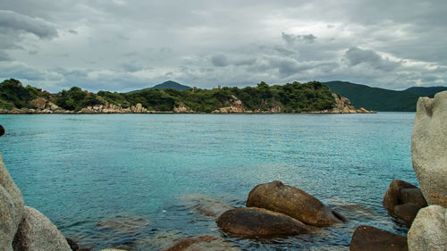 Scenic view of bay against sky