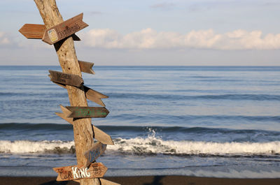 Italy, region tuscany. wooden signposts on the beach.