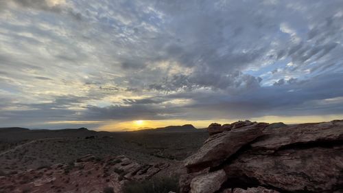 Scenic view of rocky mountains against sky during sunset