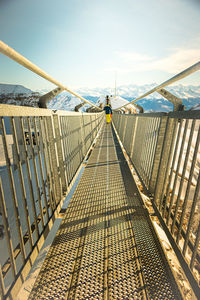 Footbridge against sky