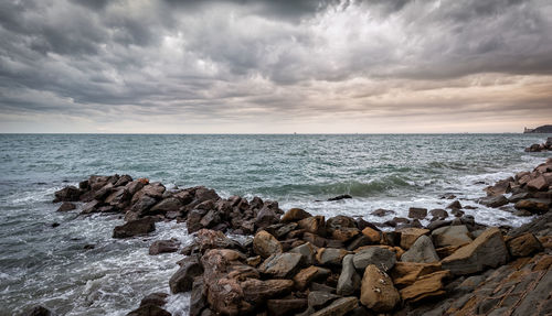 Scenic view of sea against cloudy sky