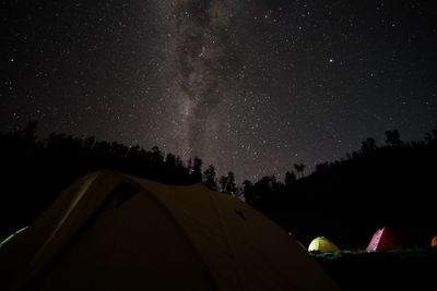 Tent against sky at night