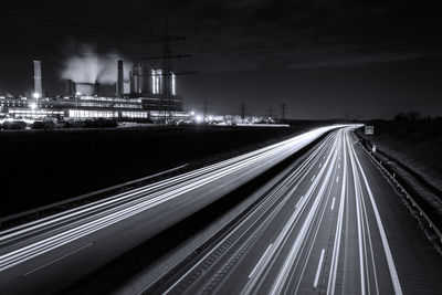 High angle view of light trails on road at night