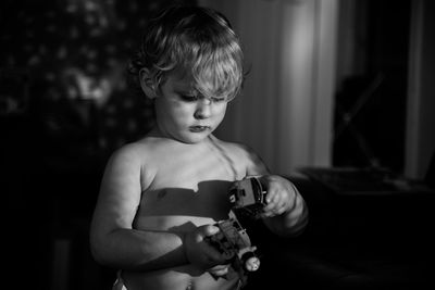 Close-up of boy playing with toys