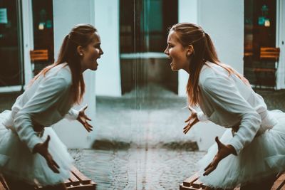 Side view of woman sitting in water