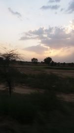 Scenic view of landscape against sky during sunset