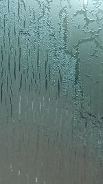 Full frame shot of water drops on glass window