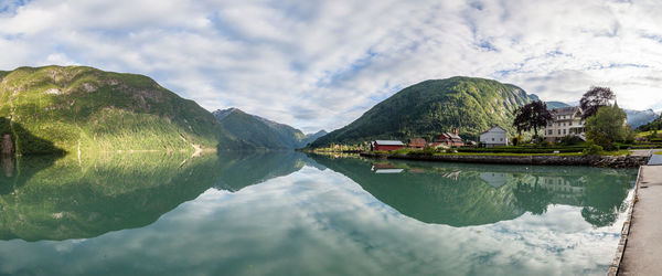 Scenic reflection of mountains and clouds in lake