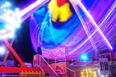 Low angle view of illuminated lights at night