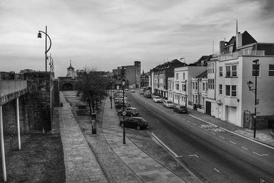 City street against cloudy sky