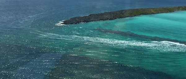 Scenic view of sea against blue sky