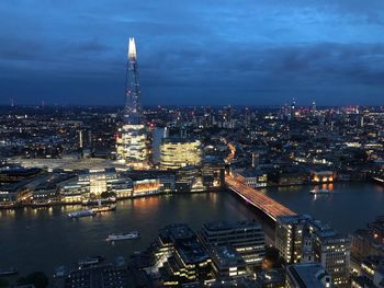 High angle view of city lit up at night