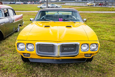 Yellow vintage car on field