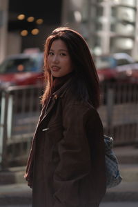 Portrait of young woman looking away