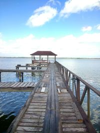 Pier over sea against sky