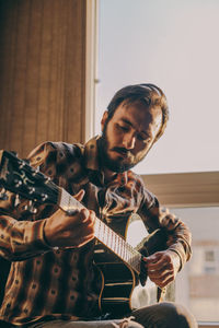 Young man playing guitar