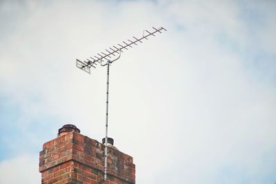 Low angle view of birds against sky