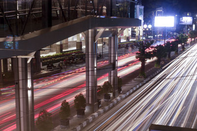 Traffic light trails on road in city at night