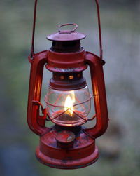 Close-up of illuminated lantern against black background