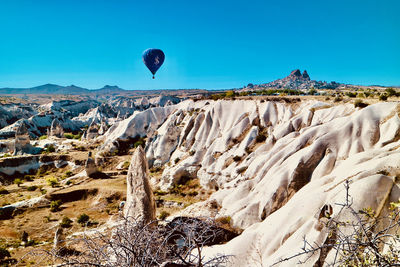 Panoramic view of landscape against clear blue sky