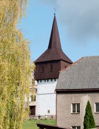 Wooden renaissance bell tower at the church of all saints. it was built in 1610. hronov, czechia.