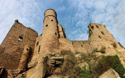 Low angle view of historical building against cloudy sky