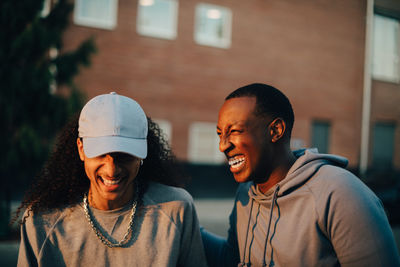 Portrait of happy friends looking at camera