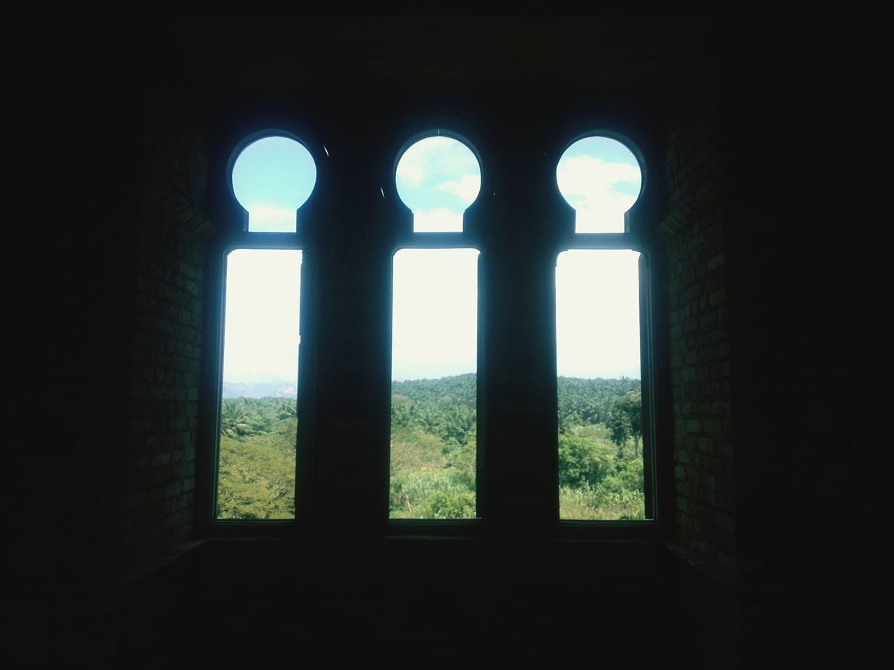 indoors, arch, architecture, built structure, history, dark, window, old ruin, old, no people, day, the past, ancient, sunlight, archway, silhouette, stone wall, wall - building feature, architectural column, sky