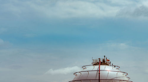 Low angle view of factory against sky