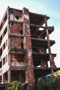 Low angle view of old building against sky