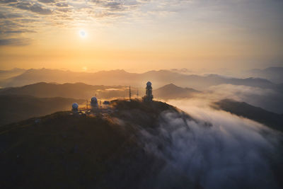 Scenic view of mountains against sky during sunset