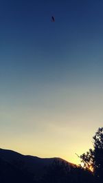 Scenic view of silhouette mountains against clear sky