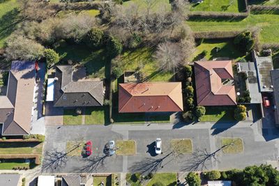 High angle view of trees and building in village