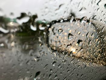 Full frame shot of wet glass window during rainy season