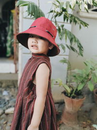 Portrait of boy wearing hat standing outdoors